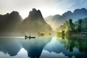 Boat on a misty river
