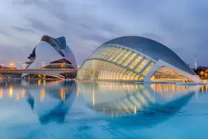 Futuristic arts complex reflected in water
