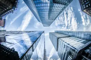 Looking up between glass towers