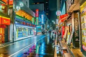 Neon reflections on a wet street