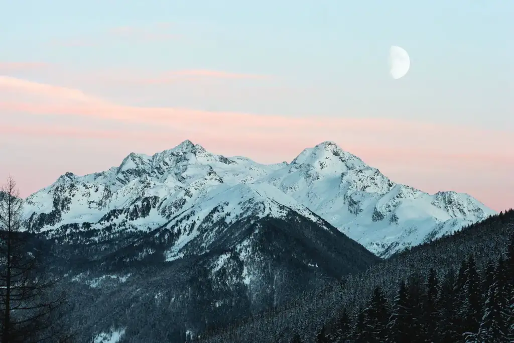 Snowy peaks under pastel sky