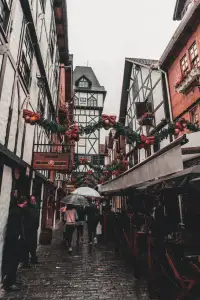 Umbrellas in a narrow lane