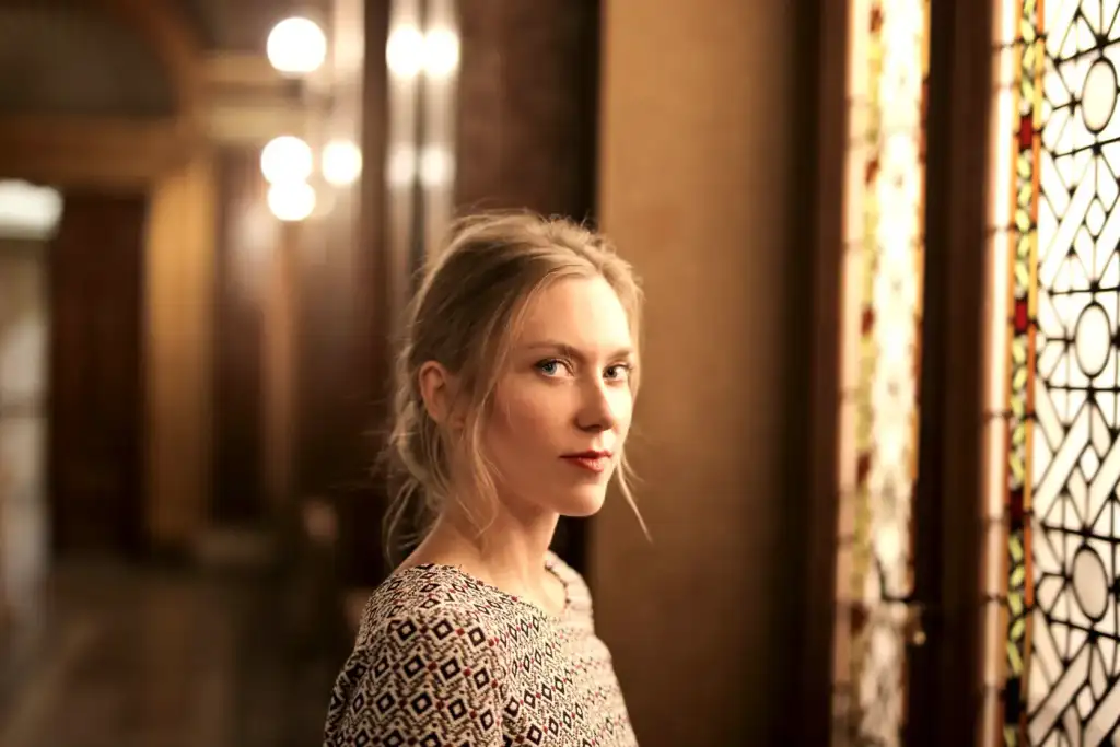 Woman in warm hallway light