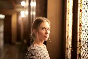 Woman in warm hallway light