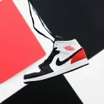 black white and red nike high top sneaker