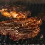 grilled meat on black charcoal grill
